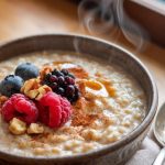 A bowl of creamy, slow-cooked steel-cut oatmeal topped with fresh berries