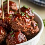 finished BBQ meatballs in a white serving dish