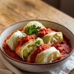 A hearty bowl of unstuffed cabbage rolls served in a rustic white bowl