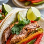 soft flour tortillas filled with juicy shredded chicken, caramelized bell peppers, onions, and tomatoes