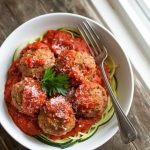 A bowl of perfectly cooked meatballs covered in rich tomato sauce