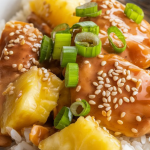 A bowl of Slow Cooker Hawaiian Pineapple Chicken served over white rice