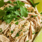 shredded cilantro lime chicken served in a rustic white bowl