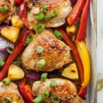 finished Hawaiian Sheet Pan Chicken Dinner garnished with sesame seeds and sliced green onions, everything golden and slightly charred