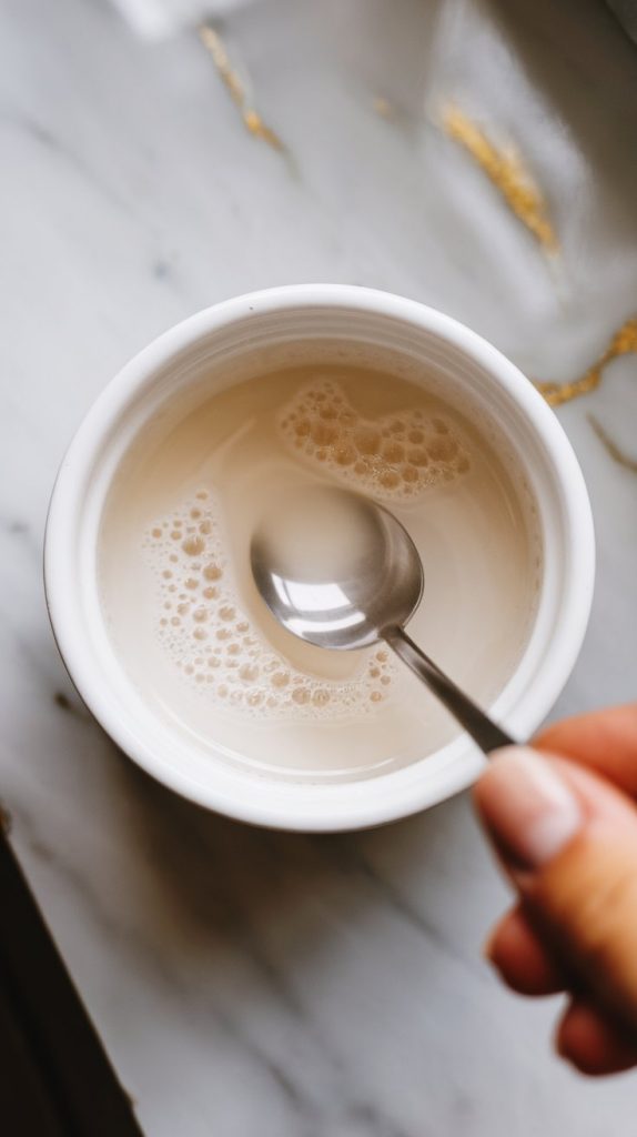 cornstarch and water being mixed in a small white ramekin until smooth and milky