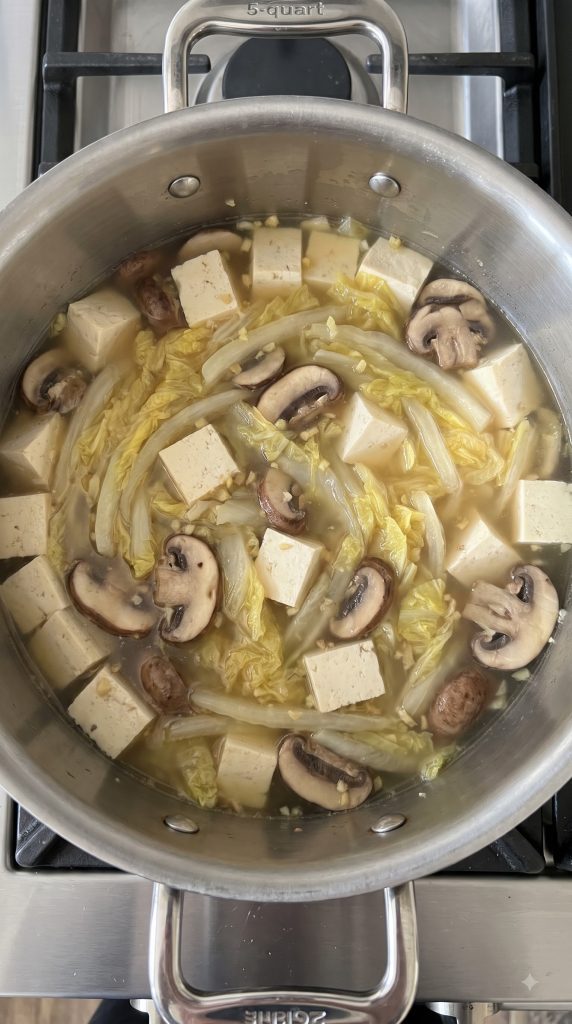 Step 4: Gently Cook the Tofu and Leaves